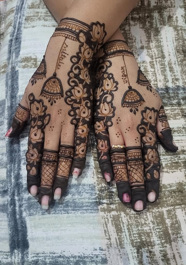 Bridal mehendi — names woven into the design