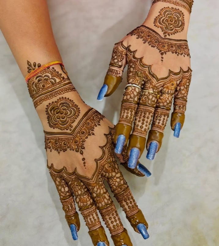 Mehendi — floral mandala with nail art